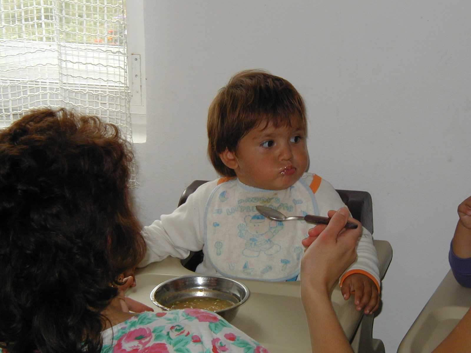 Feeding a baby at Bistritia.